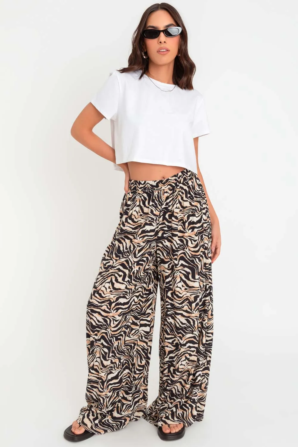 Pantalón animal print de fit palazzo cintura alta