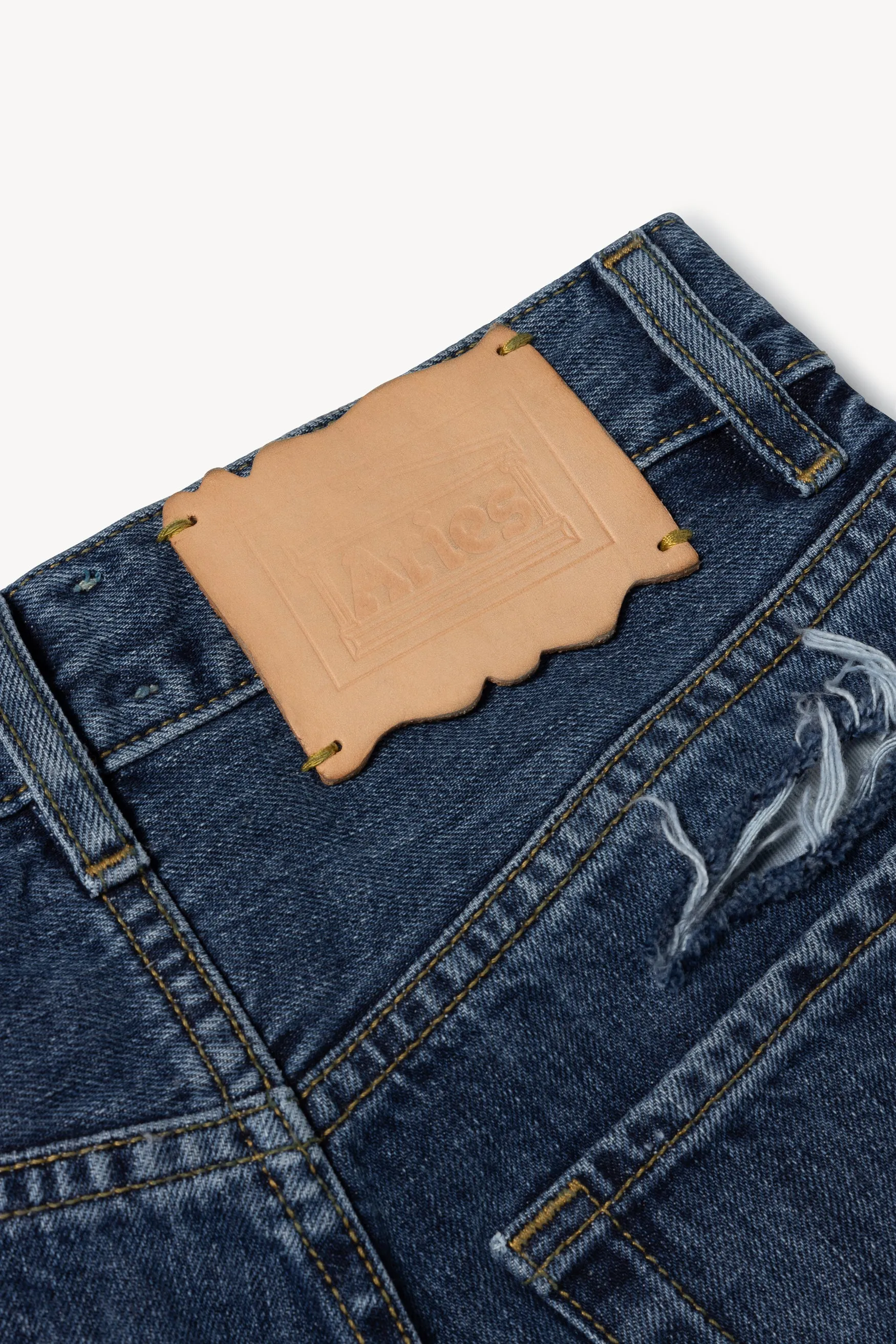 Slashed Vinyl Jeans